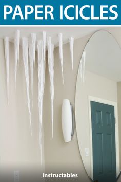 icicles hang on the wall next to a mirror