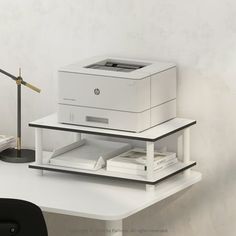 a printer sitting on top of a white desk