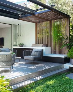 an outdoor living area with furniture and plants