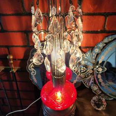 a red lamp sitting on top of a table