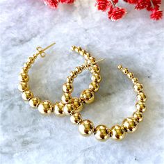 Elegant graduated bead hoop earrings for Women. These stunning gold graduated bead hoop earrings are the perfect way to add a touch of elegance to any outfit. The earrings feature a series of graduated beads that cascade down from the hoop, creating a beautiful and eye-catching effect. The earrings are made high polished 18K gold filled finish.  🎁 Item ships nicely packaged ready to gift in elegant jewelry boxes. ♻️ Our jewelry boxes are reusable and recyclable. Product Details: Metal: 18K Gold Gold Beaded Hoop Earrings, Gold Beaded Hoop Earrings Gift, Everyday Gold Beaded Hoop Earrings, Hoop Earrings Large, Bead Hoop Earrings, Ashley Nicole, Gold Filled Hoops, Hoop Earrings Gold, Earrings Minimalist