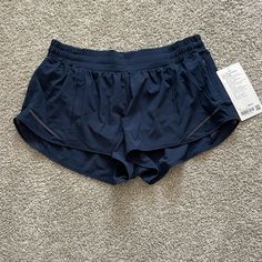 Lululemon Hotty Hot Shorts Navy 2.5” Inseam Low Rise Lined Running Nwt Pet Free Smoke Free Home. Navy Lululemon Shorts Outfit, Lululemon Shorts Collection, Navy Blue Lululemon Shorts, Running Outfit Aesthetic, 2.5 Lululemon Shorts, Lulu Lemon Hotty Hot Shorts, Lululemon Shorts Hotty Hot, Athletic Outfit Summer, Running Shorts Outfit