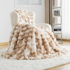 a white chair covered in a large furry blanket