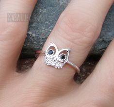 Owl silver ring, CZ owl ring, silver ring, 925 silver ring Sizes 5-10 *IF YOUR SIZE ISNT SHOWING, MESSAGE ME. I might be sold out and will be able to replenish shortly* Center Stone: 9 mm Stone: Black & Clear CZ Metal Material: Sterling Silver Email me if you have any questions. Handmade Cute Sterling Silver Rings, Cute Handmade Sterling Silver Rings, Cute Silver Ring Jewelry, Cute Silver Open Ring Jewelry, Cute Silver Open Ring, Cute Silver Rings For Gift, Handmade Silver Cubic Zirconia Rings, Cute Silver Rings For Anniversary, Owl Ring