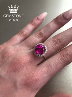 This Elegant Solid 14k Gold Ring has a Lab Created Round Pink Sapphire center stone and is accompanied by a beautiful Diamond halo, creating a dazzling and one of a kind handcrafted piece. It is intricately designed and crafted by our jewelers to create the perfect finish. This ring is designed with elegance and precision so it is  the perfect gift for a loved one for any occasion - Birthday, Mother's day, Anniversary, or Graduation! The Sapphire gemstone represents the month of September and symbolizes loyalty, purity, wisdom, and precision as you are focused on achieving bigger things in your life through diligence.  Measurements: 10K Gold - 3.7 Grams 14K Gold - 3.9 Grams Stone:  1 Pc - Lab Created Pink Sapphire - 10 mm Round 18 Pc - Natural White Diamonds - 2.2 mm Round - 0.72 CTS If yo Amethyst Gold, Pink Sapphire Ring, Zierlicher Ring, Large Ring, Pink Jewelry, Solid Gold Rings, 14k Gold Ring, Halo Diamond Ring, Pink Ring