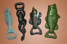 three different types of fish and frog figurines