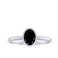 Product Details The Simple Oval Cut Black Onyx Solitaire Ring in a Bezel Setting is a timeless piece of jewelry that exudes elegance and sophistication. This stunning ring features a 6X8 MM oval black onyx center stone in a straight shank type. The sleek and modern design is perfect for everyday wear, while the black onyx gemstone adds a touch of luxury. The bezel setting is a classic and secure way to set the gemstone, ensuring that it will stay in place for years to come. This ring is perfect Onyx Gemstone, Ring Sizer, Bezel Setting, Yellow Gold Rings, Solitaire Ring, Oval Cut, Black Onyx, Timeless Pieces, The Black