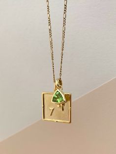 Choose your favourite gold charm and birthstone, add it to a chain and treat yourself to some personalised jewellery. 14k Gold Square Pendant Necklace With Birthstone, Elegant Brass Charm Necklace With Large Pendant, Elegant Green Jewelry In Recycled Gold, Formal Gold Sterling Silver Emerald Necklace, Elegant Brass Necklace With Rectangular Pendant, Gold Emerald Necklace As Gift, 14k Gold Square Pendant Necklace With Charms, Gold Plated Emerald Necklace Fine Jewelry, Gold Plated Emerald Necklace In Fine Jewelry Style