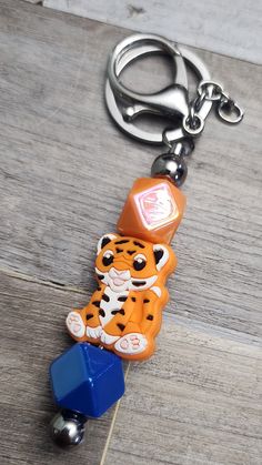 Auburn Tiger Key Chain. $ 8.00 Free Shipping. local Free Delivery. Shades Of Gold, Wristlet Keychain