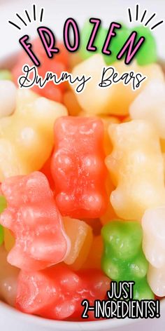 a bowl filled with gummy bears sitting on top of a table