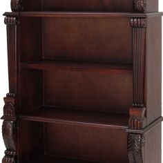 a wooden bookcase with carved details on the front and bottom shelves, in dark wood