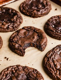 chocolate cookies are on a baking sheet ready for the oven to be baked into them