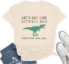 PRICES MAY VARY. Preschool Teacher Shirt: Cotton blend, soft, wrinkle free, breathable and stretchy fabric, comfy to your touch Funny Dinasour Shirt Ladies: This funny "Lets Eat Kids, punctuation saves lives" letter printed and dinasour graphic shirt is very cute and beautiful, lightweight, classic fit Dino T Rex Tee: Punctuation teacher shirts will be the nice match with you, this women stretch top suitable for casual, daily wear, outdoor activities, vacation any other special occasion Kinderga Funny Preschool Teacher Shirts, Funny Teacher Shirts, Teacher Tee Shirts, Kindergarten Teacher Gifts, Lets Eat, Preschool Teacher Shirts, Teacher T Shirts, Preschool Shirts, English Teacher Gifts