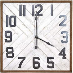 a square wooden clock with numbers on the front and sides, in whitewashed wood