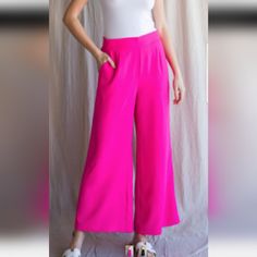 These Are Stunning And Super Comfortable! Bright , Vibrant , Hot Pink / Fuchsia Wide Leg Boho Chic Pants. Super Flowy With A Very Flattering Stretchy Ruched Waistband. They Are 100 Percent Polyester But Very Lightweight Lightweight And Perfect For Spring Or Summer! Great For Work Or Lounging Around! Dress Up Or Dress Down. Work Or Play! Pair With A Tank Or Basic Tee Or For Cooler Weather Add A Blazer Or A Cardigan! Or Just Add A Bralette And Floppy Hat Beach Vaycay Vacation Ready. Super Cute. Si Chic Pink Pants With Elastic Waistband, Solid Flirty Bottoms For Spring, Flirty Solid Color Bottoms For Spring, Flirty Stretch Bottoms For Day Out, Pink High-waisted Wide Leg Pants For Night Out, Pink Wide Leg Pants For Night Out, Pink High-waisted Bottoms For A Day Out, Stretch Pink Bottoms For Day Out, Pink High-waisted Pants For Day Out