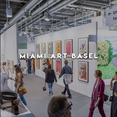 people are walking around an art gallery with the words miami art base above it that reads,