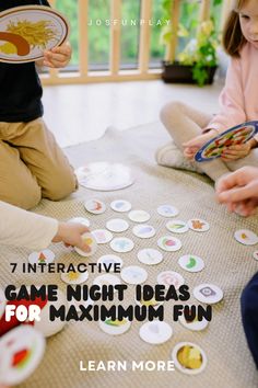 two children playing with paper plates on the floor and one child is holding a book