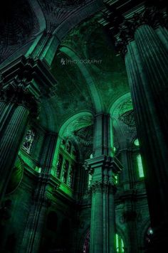 the interior of an old church lit up in green