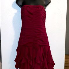 Formal Flirty Lined Dress, Flirty Formal Lined Dress, Fitted Mini Dress For Holiday Evenings, Fitted Sleeveless Midi Dress For Holiday Party, Red Strapless Fitted Dress With Ruffles, Red Fitted Strapless Dress With Ruffles, Ruched Dress For Holiday Party, Ruched Fit And Flare Cocktail Dress, Fitted Ruched Mini Dress For Holiday Party