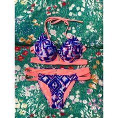 Tinibikini Bikini Set. Size Small. Pretty Purple/Peach Geo Tribal Print. New Without Tags. Bottoms Still Have Hygiene Strip. Push-Up Top With Underwire And Neck Tie. Flattering Cage Band Detailing With Back Clasp. No Scratches On Clasp. Cheeky Hipster Bottoms With Elastic Side Straps Detail. Purple Triangle Top Swimwear For Beachwear, Purple Stretch Swimwear For Beach, Purple Halter Neck Swimwear For Pool, Purple Halter Neck Swimwear For Beach Party, Poolside Purple Halter Neck Swimwear, Purple Triangle Top Swimwear For Poolside, Purple Tie-side Bottom Swimwear For Swimming, Purple Tie-side Swimwear For Swimming, Purple Underwire Swimwear For Swimming