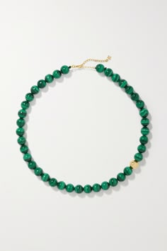 Mateo's jewelry is both modern and timeless, so you can feel good investing in pieces knowing you'll enjoy them now and for years to come. This necklace is hand-strung with a glossy malachite beads contrasted by a single 14-karat gold one. It makes a statement worn solo, or you can layer it with longer styles from the brand. Luxury Green Onyx Gemstone Jewelry, Luxury Faceted Emerald Jewelry, Elegant Green Onyx Jewelry With Polished Beads, Luxury Malachite Necklaces For Gifts, Luxury Faceted 14k Gold Necklaces, Luxury 14k Gold Faceted Necklaces, Formal Malachite Jewelry With Polished Finish, Round Malachite Gemstone Bead Jewelry, Luxury 14k Gold Faceted Necklace