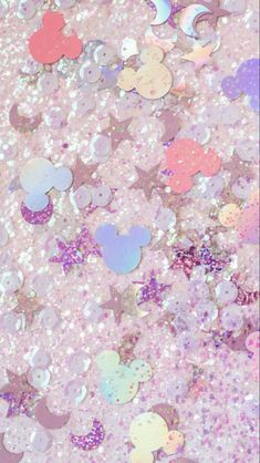 a pink and purple background with lots of different colored confetti