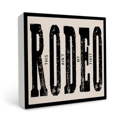 a black and white sign that says rodeo