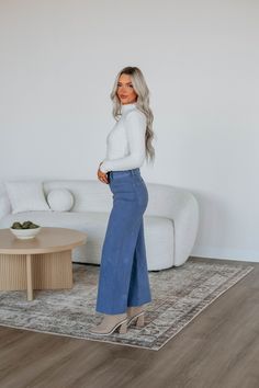 Details: Linsley Wide Leg Pants High Rise Zip Fly Button Closure Wide Leg Denim Material Minimal Stretch Raw Edge Frayed Hems Available in Multiple Colors Rise: 12" Inseam: 28" Material: 98% Cotton and 2% Spandex We are recommending: Small - Sizes (24-25) Medium - Sizes (26-27) Large - Sizes (28-29) Relaxed Fit Wide-leg Washed Blue Bottoms, Mid-rise Blue Cotton Wide Leg Pants, Chic Mid-rise Denim Blue Wide Leg Pants, Non-stretch Denim Blue Wide Leg Pants, Denim Blue Mid-rise Relaxed Fit Wide Leg Pants, Athleisure Shorts, Slate Blue, Wide Leg Denim, Cardigan Jacket