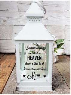 a white lantern with the words because someone we love is in heaven there's a little bit of heaven at our wedding mum