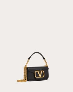 Valentino Garavani Locò women's small shoulder bag in calfskin leather with VLogo Signature metallic element. Equipped with a detachable sliding chain strap and a removable handle, this accessory can be worn as a crossbody/shoulder bag or carried as a handbag. - Antique brass-finish hardware - Magnetic closure - Removable leather handle - Shoulder strap with detachable sliding chain - Nappa leather lining. Interior: one slip pocket Shoulder strap drop length: 55 cm / 21.6 in. - Dimensions: W20xH Small Shoulder Bag, Nappa Leather, Minimal Fashion, Leather Handle, Crossbody Shoulder Bag, Chain Strap, Shoulder Bag Women, Valentino Garavani, Bag Making