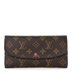 This is an authentic LOUIS VUITTON Monogram Emilie Wallet in Red. This stylish wallet is crafted of durable Louis Vuitton monogram print canvas. The wallet features a flap that opens with a red snap to a red cross-grain leather interior with credit card slots, a bill compartment, and a zippered pocket. Louis Vuitton Wallet Women Louis Vuitton Official, Louis Vuitton Clutch Wallet, Lv Wallet Women Louis Vuitton, Louis Vuitton Micro Wallet, Emilie Wallet, Monogram Prints, Red Cross, Leather Interior, Authentic Louis Vuitton