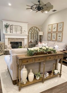 a living room filled with furniture and a fire place in the middle of the room