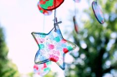 some colorful glass stars hanging from strings