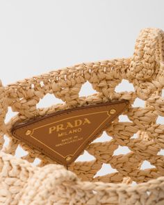 Raffia-effect yarn Crochet handles Lettering logo embroidered on the front Unlined interior Fabric Crochet, Crochet Handles, Crochet Shoulder Bag, Prada Shoulder Bag, Prada Logo, Crochet Tote Bag, Woven Tote Bag, Body Composition, Crochet Tote