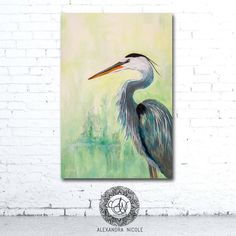 a painting of a blue heron on a white brick wall