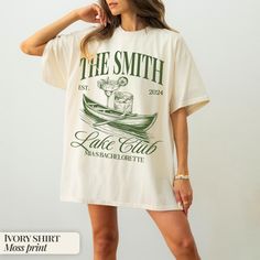 a woman wearing a white shirt with the words free smith on it and a boat