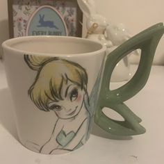 Tinker Bell Disney Brand New Mug. Teacups Pottery, Mugs With Animals Inside, Disney Trinkets, Disney Pottery Ideas, Coffee Mugs Unique, Disney Items, Disney House Decor, Mug Aesthetic, Mug Inspiration