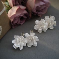 "Floral romantic earrings with white gardenia flowers made of polymer clay. This is a lovely bridal earrings, unique eye catching design of jewelry. Buy this beautiful romantic earrings for yourself or someone special. Ideal for a wedding! Also great for Bridesmaids. Pick the necklace, bracelet or headpieces for bride, bridesmaids and flower girls in the same theme. Invite flowers to your wardrobe with this art hair accessories! If you have any questions regarding this product please do not hesi Handmade Polymer Clay Flower Earrings For Weddings, White Polymer Clay Flower Earrings For Gift, Clay Wedding Earrings Floral, Elegant White Polymer Clay Flower Earrings, Flower-shaped Polymer Clay Wedding Earrings, Sister Bridesmaid, White Gardenia, Romantic Earrings, Bride Sister