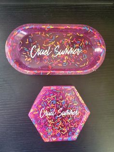 two pink trays with colorful sprinkles and the words cruel summer on them