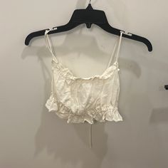 H & M Ruffled White Crop Top - Size Medium; Runs Small. Typically I Am A Small. Ties In Back To Allow For Strap Adjustments. Never Worn. Flirty Cotton Tops For Spring, Spring Flirty Cotton Tops, Chic Cotton Crop Top With Ruffles, Feminine Ruffled Crop Top For Vacation, Feminine Ruffled Crop Top For Brunch, Chic Cotton Tops With Ruffled Straps, Feminine Ruffled Crop Top For Day Out, Beach Cotton Tops With Ruffled Straps, Trendy Cotton Crop Top With Ruffles