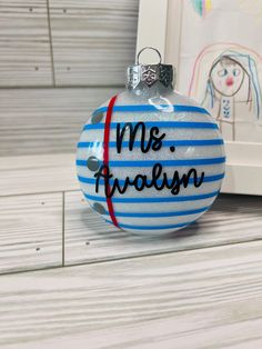 a blue and white ornament with the word mr & mrs written on it