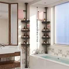 a bath room with a tub a sink and a mirror on the wall next to a window