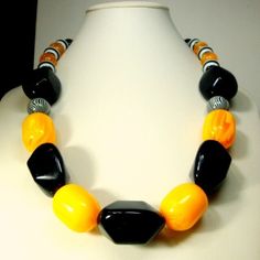 "MANS Black & Egg Yolk Yellow, Striped White Black, All Solid Resin Bead Necklace By Rachelle Starr Blaxberg, OOAK, Big and Bold This original necklace design is 22\" ( 55.88cm ) elegant, tribal understated large Egg yolk yellow barrels are 1\" or 25mm long by 7/8\" wide ( 24mm ) --------------------------------- PLEASE NOTE I ONLY ship to your paid ETSY invoice address, Please ask any questions..I answer, 7 Days a Week, except when I am sleeping! VINTAGESTARRBEADS www.vintagestarrbeads.etsy.com Black Vintage Jewelry With Multicolored Beads, Vintage Black Jewelry With Colorful Beads, Black Retro Handmade Jewelry, Retro Style Handmade Black Necklace, Retro Black Handmade Jewelry, Vintage Black Beaded Necklace With Colorful Beads, Black Vintage Beaded Necklaces With Colorful Beads, Puka Shell Necklace, Original Necklace