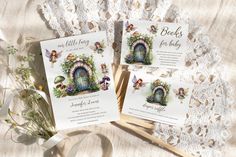 two cards with fairy doors on them sitting next to a lace doily and flowers