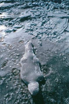 an icy river with ice on the water