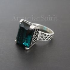 Searching for ring made of sterling silver 925 and rectangle teal stone? Pay attention to this ring. This ring is made with a tall stone in the shape of a rectangle. The stone has a rare and unusual color. It will suit the dress, coat, scarf of teal color. FREE shipping Worldwide (tracked) We make the same set with different stone colors: teal, purple and dark burgundy. Ring: Sterling silver 925, zircon Weight: 10 grams Dimensions of the stone approximately: 0.8 inchX0.5 inch = 1.5 cmX1 cm Earri Sterling Silver Rings With Jewels For Gifts, Sterling Silver Green Jewelry With Jewels, Green Sterling Silver Jewelry With Jewels, Elegant Turquoise Sterling Silver Jewelry, Elegant Hallmarked Turquoise Jewelry, Emerald Jewelry With Stone Setting For Gift, Stamped 925 Emerald Jewelry, Green Sterling Silver Jewelry With Stone Setting, Elegant Turquoise Jewelry With Jewels