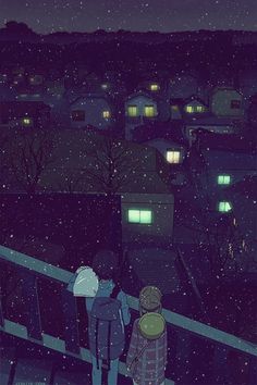 two people looking at the night sky with buildings in the background and snow falling on them