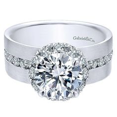 a white gold engagement ring with diamond accents