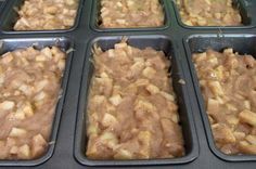 several trays filled with food sitting on top of a counter next to each other