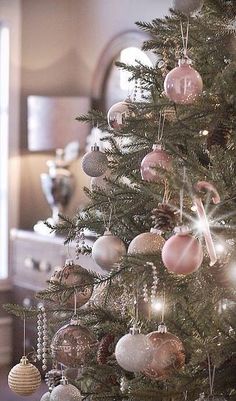 a christmas tree with ornaments hanging from it